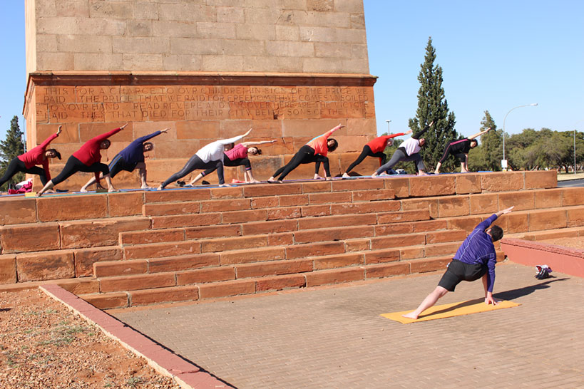 Doing the trikonasana